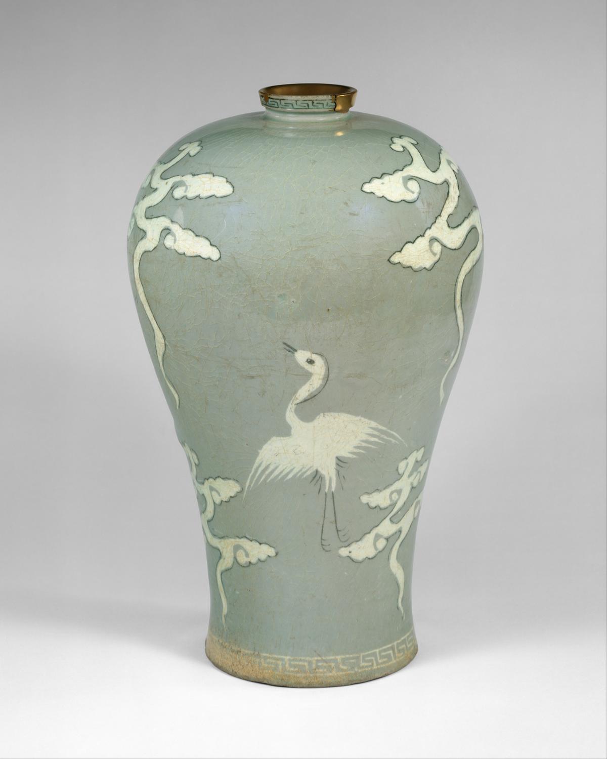 Maebyeong (plum bottle) decorated with cranes and clouds, late 13th century, from Korea's Goryeo dynasty (918–1392). Stoneware with inlaid design under celadon glaze; 11 1/2 inches by 7 1/8 inches by 4 3/8 inches. Metropolitan Museum of Art, New York City. (Public Domain)