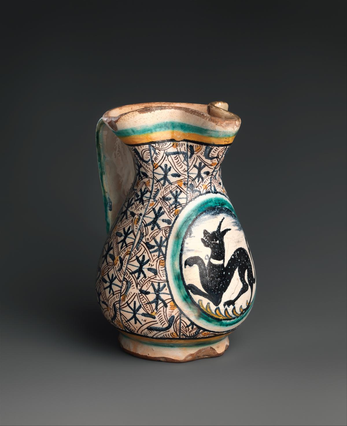 Italian jug, circa 1480–1500, from Florence or environs (probably Montelupo). Tin-glazed earthenware (maiolica); 6 15/16 inches by 4 1/2 inches. Metropolitan Museum of Art, New York City. (Public Domain)