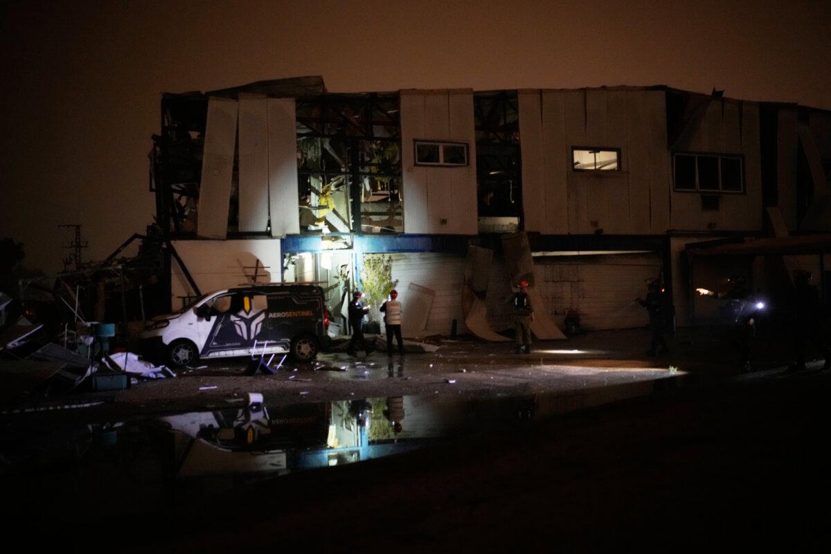 Rescue teams inspect a site hit by an Iranian missile in Petah Tikva, Israel, on April 2, 2026. (Ohad Zwigenberg/AP)