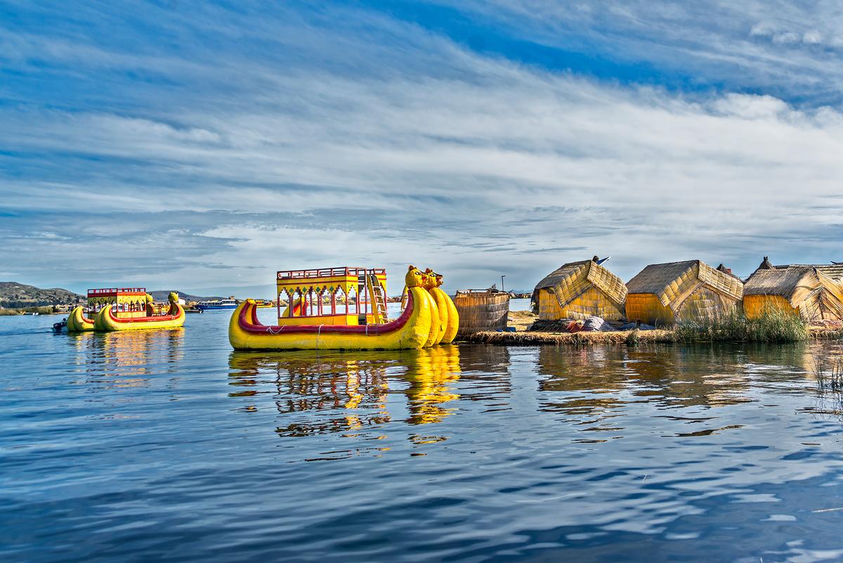 Yellow totora catamarans are unique to the Uros floating islands. (Maria Coulson)