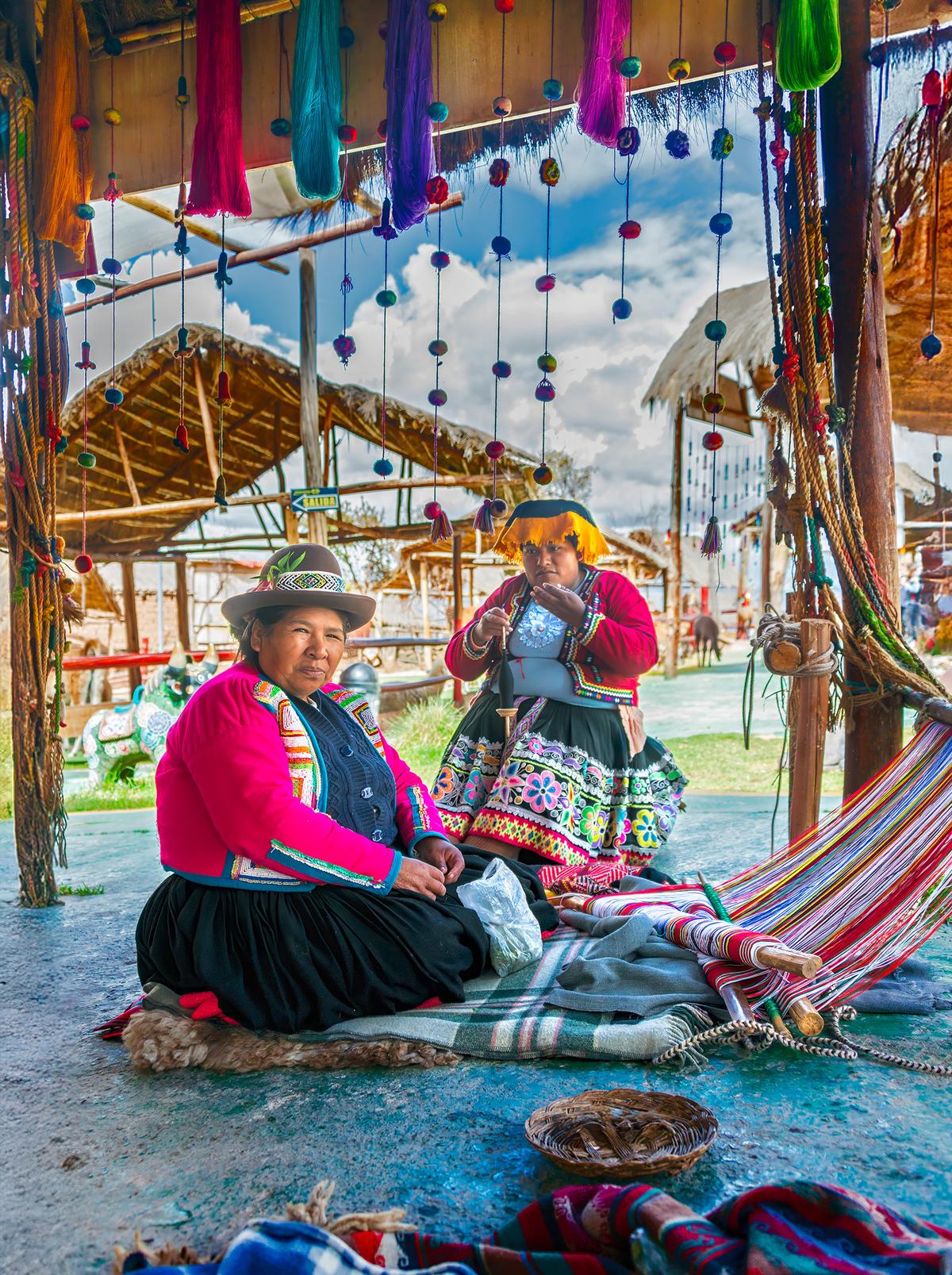 Weavers practice their ancestral craft at the Manos de la Comunidad camelid haven and textile center outside Cusco, Peru. (Maria Coulson)