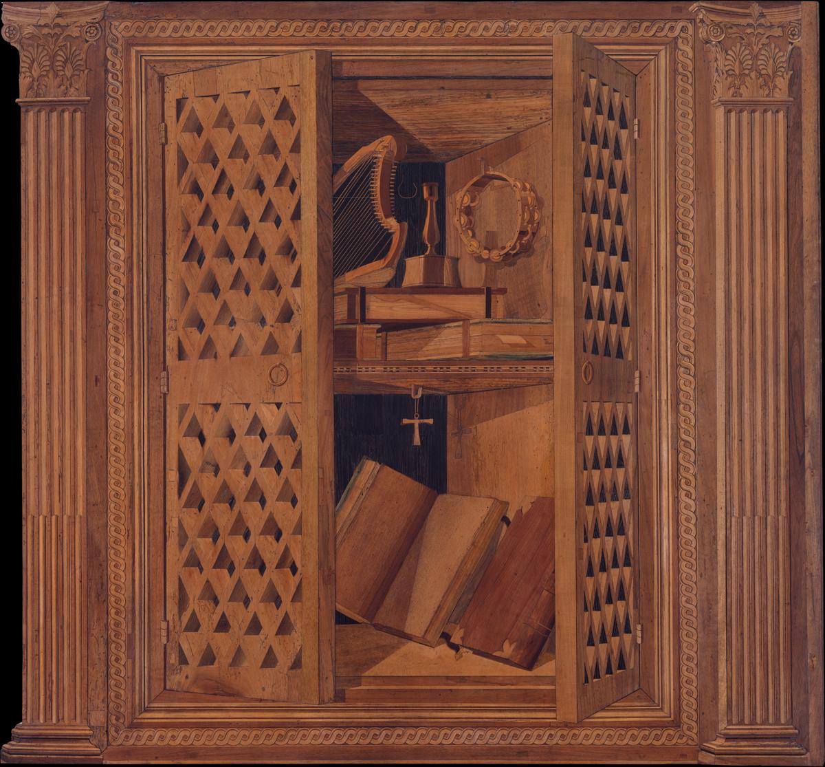 A detail of a cupboard with books, harp and turning key, wooden ring with two rows of jingles, and a brass candlestick from panel 8 of "Studiolo" from the Ducal Palace in Gubbio. Metropolitan Museum of Art, New York City. (Public Domain)