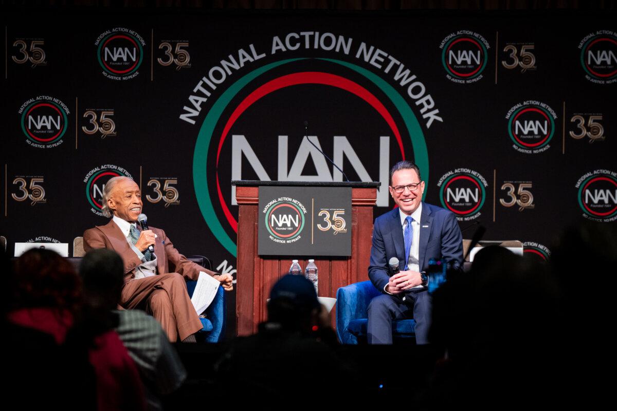 Pennsylvania Gov. Josh Shapiro (R) speaks with the Rev. Al Sharpton during the National Action Network Convention in New York on April 8, 2026. (Angelina Katsanis/AP Photo)