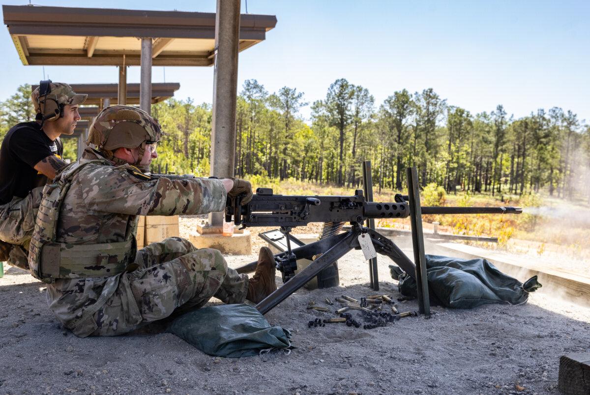 A competitor fires a .50-caliber machine gun during the 2026 Best Ranger Competition at Fort Benning, Ga., on April 10, 2026. (John Fredricks/The Epoch Times)