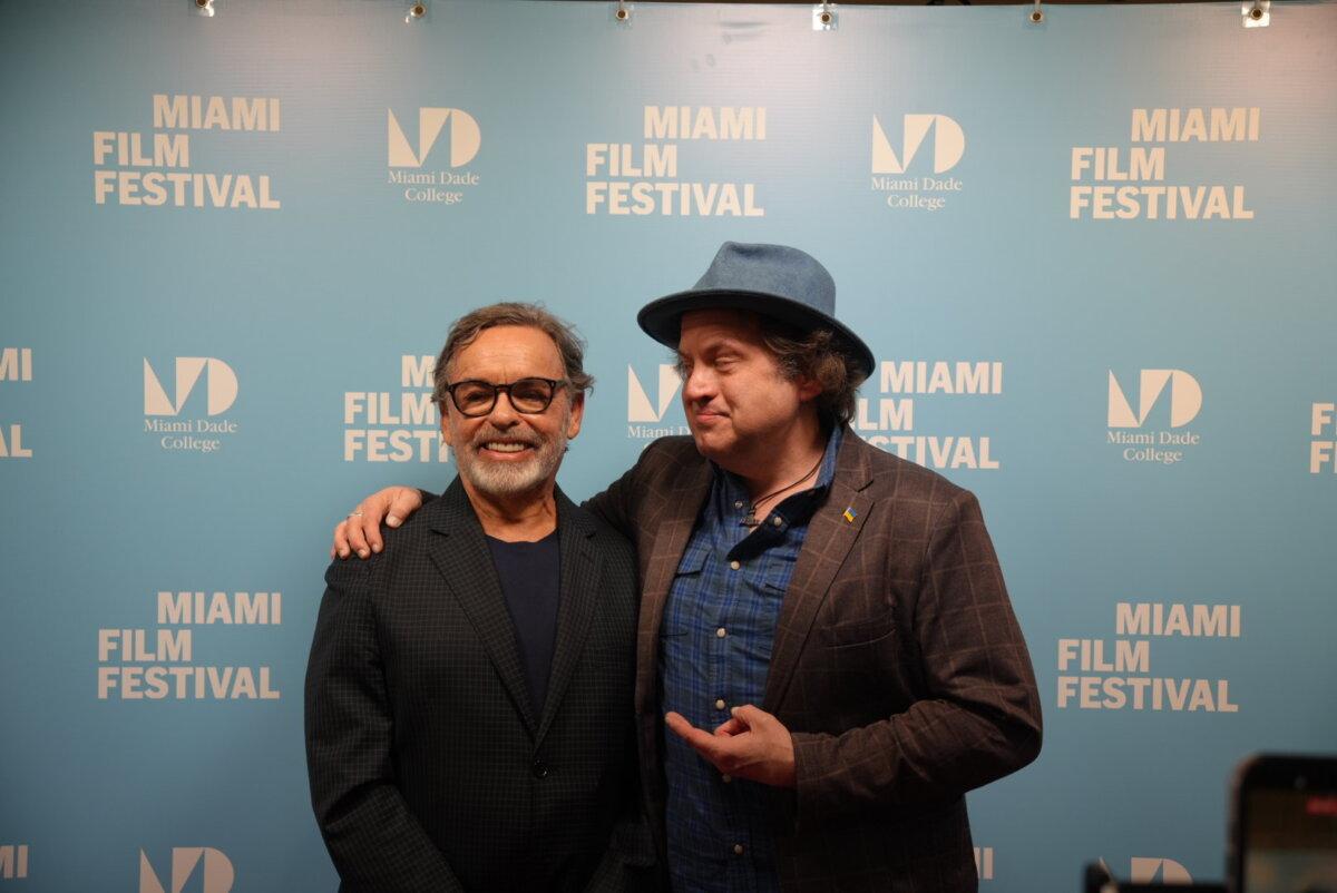 Director Thaddeus Matula (R) poses on the red carpet before the premiere of his movie "Revolution's Daughter." The film follows the story of Fidel Castro's daughter and others who advocate against the communist Cuban regime. The documentary was released in Miami, Fla., on April 10, 2026. (Troy Myers/The Epoch Times)