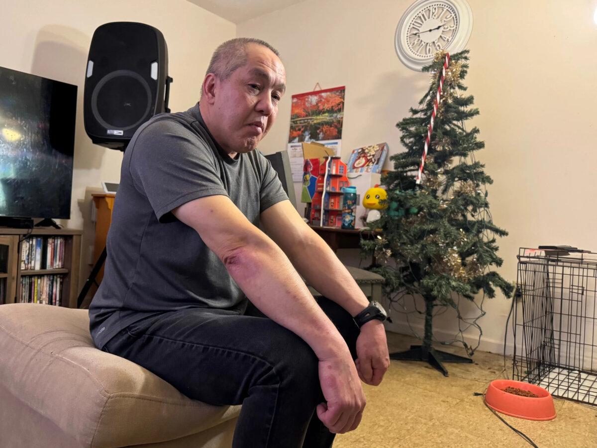 ChongLy "Scott" Thao sits for a photo at his home in St. Paul, Minn., on Jan. 19, 2026. (Jack Brook/AP Photo)