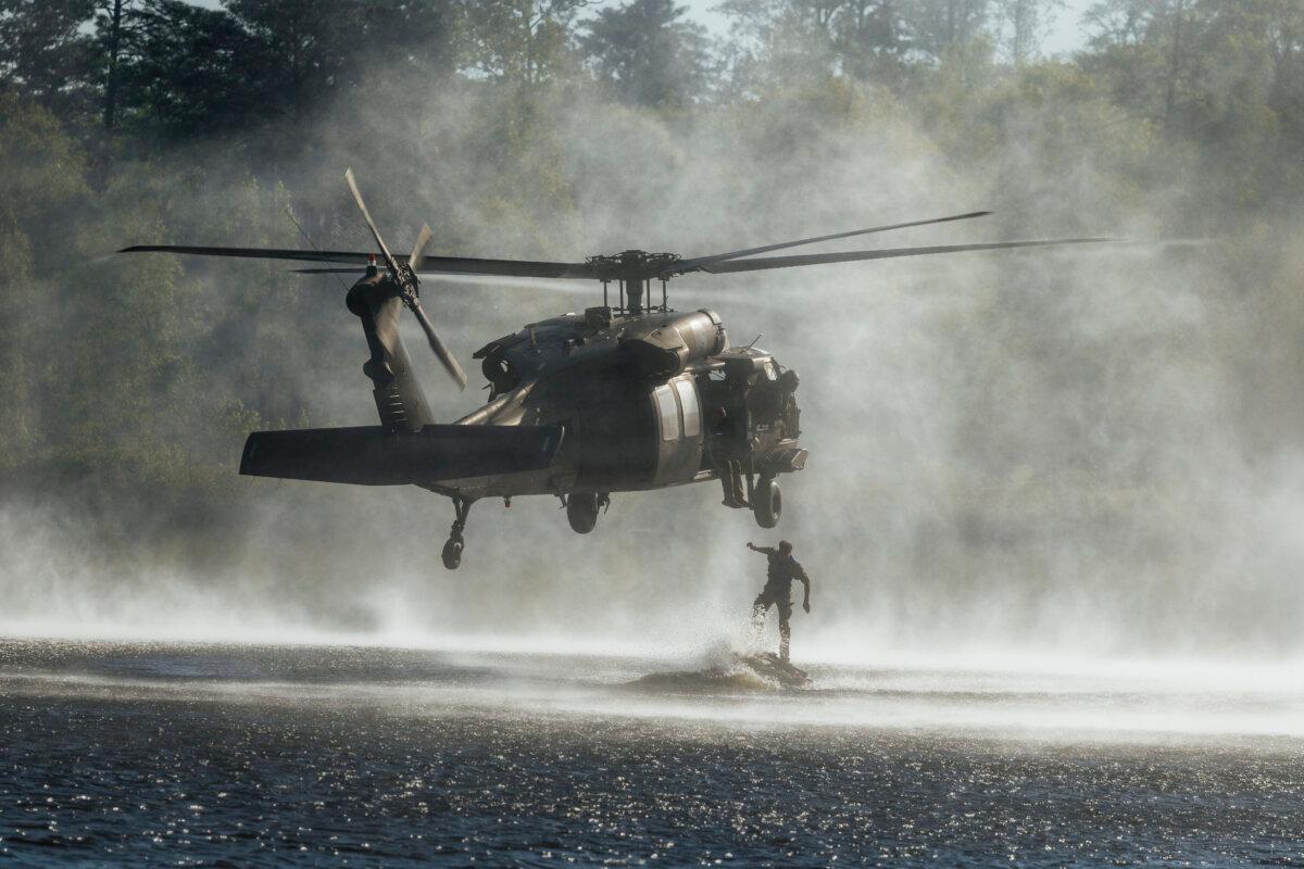 Soldiers jump from a Black Hawk helicopter into Victory Pond, at Fort Benning, Ga., on Apr. 12, 2026. (U.S. Army/Staff Sgt. Cayce Watson)