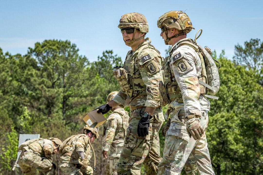 Soldiers with the U.S. Army take part in shooting exercises during the Best Mortar Competition at Infantry Week at Fort Benning, Ga., on April 8, 2026. (John Fredricks/The Epoch Times)