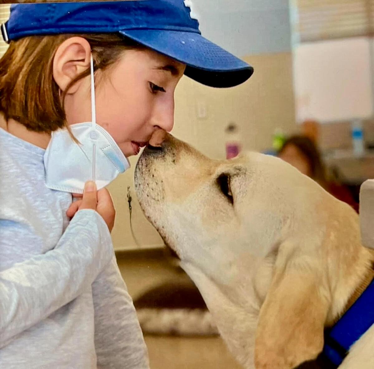 Liv (L) and Edie sharing a kiss. (Courtesy of Linda Zelik)