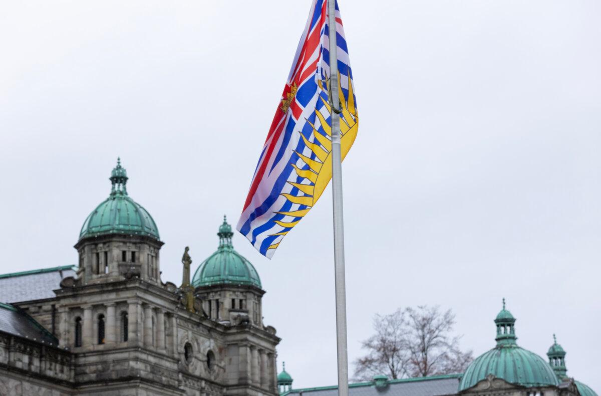 A B.C. provincial flag hangs in front of the legislature building in Victoria on April 14, 2026. (The Canadian Press/Chad Hipolito)