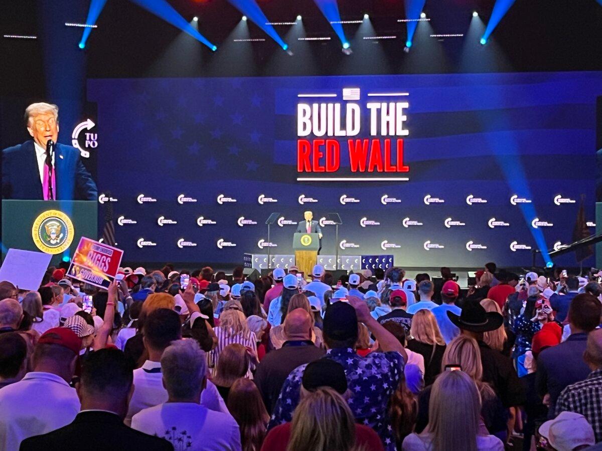 President Donald Trump arrives during a Turning Point USA "Build the Red Wall" rally in Phoenix on April 17, 2026. (Allan Stein/The Epoch Times)