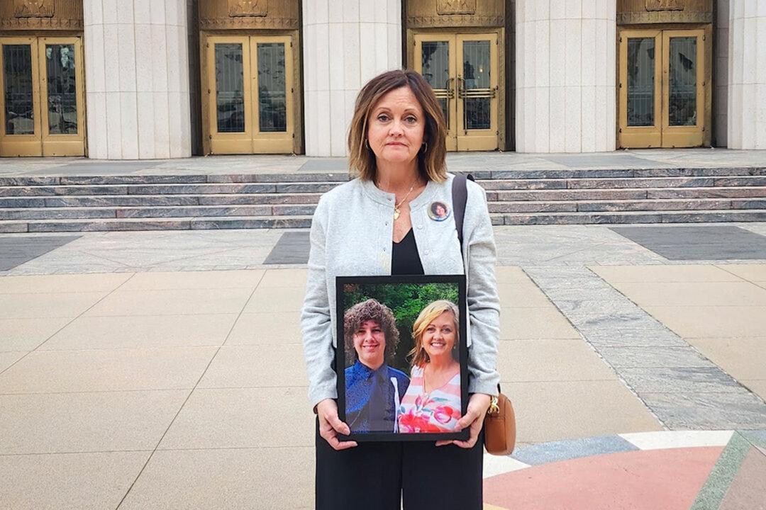 Joann Bogard holds a photo of herself with her son, Mason, at Los Angeles Superior Court in Los Angeles on Feb. 5, 2026. Mason died at age 15 in 2019 after attempting a viral “choking challenge” on YouTube. (Courtesy of Joann Bogard)