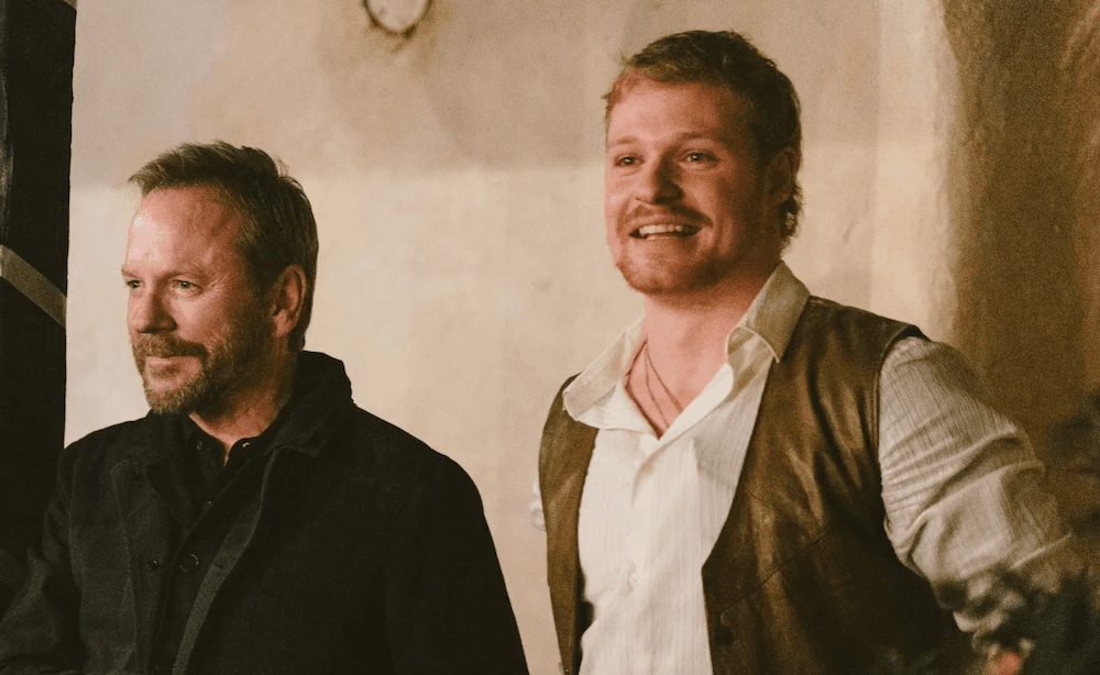 Capt. Jordan Wright (Kiefer Sutherland) and Danny (Solly McLeod), in "Brothers Under Fire." (Vertical)