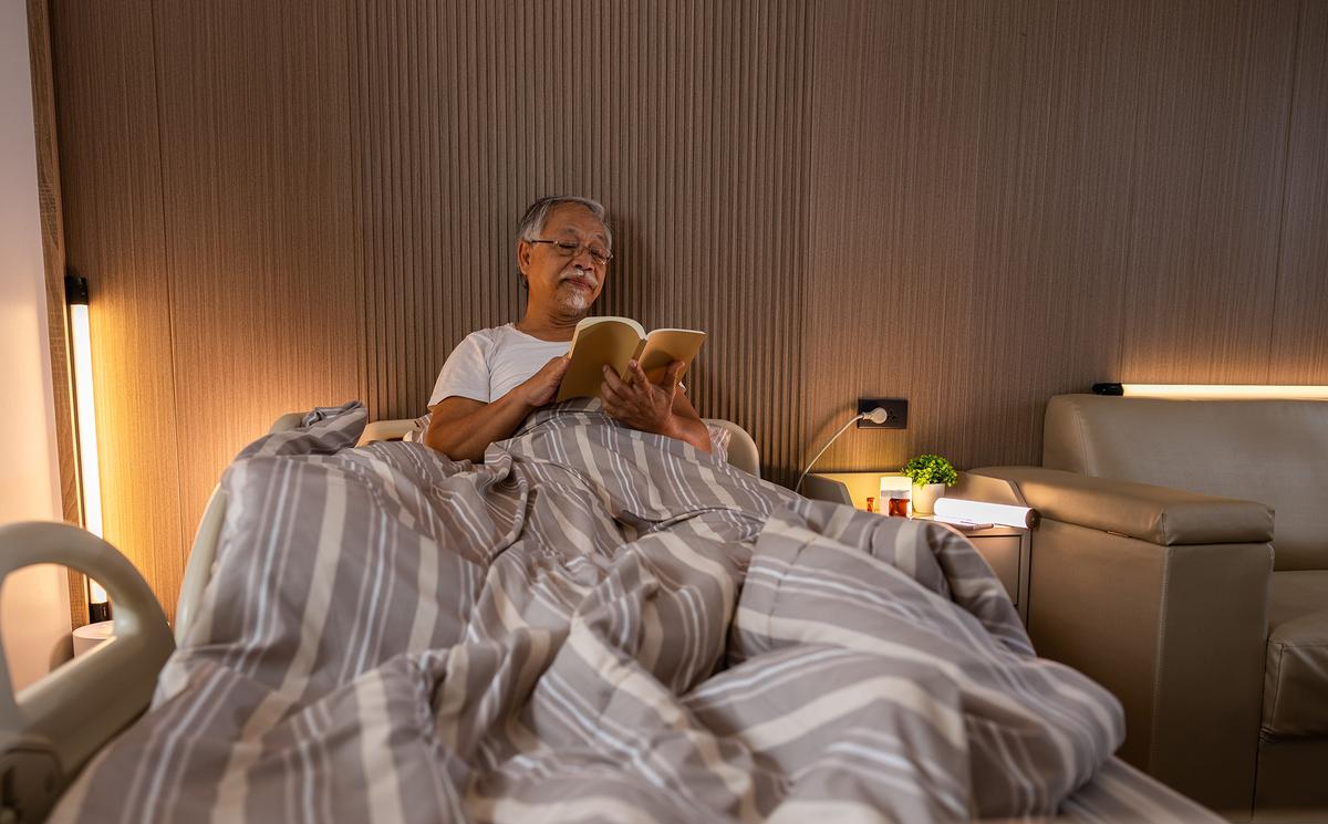 Bed rails can improve both safety and independence. (220 Selfmade studio/Shutterstock)