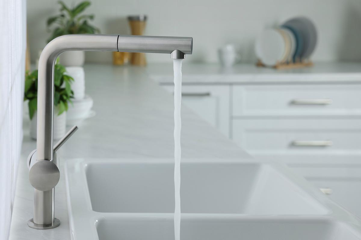 Reducing water usage can help prevent overloading a septic system and extend its life. (New Africa/Shutterstock)