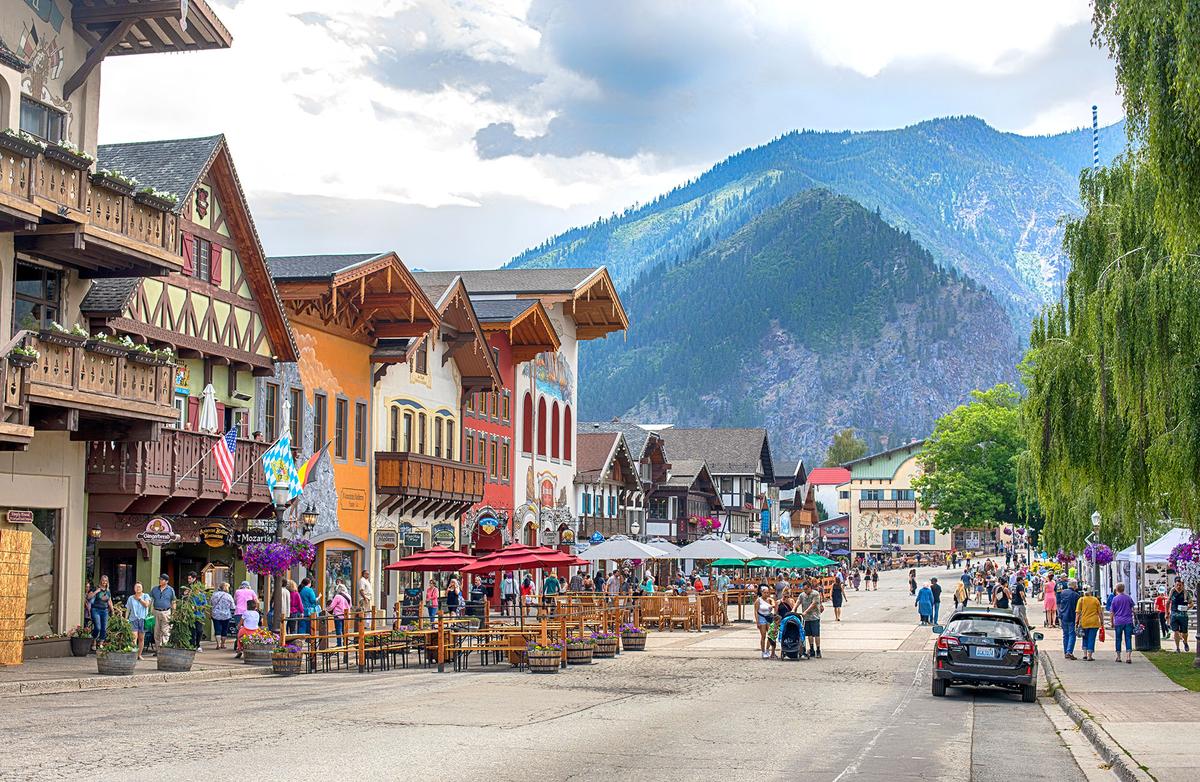 Leavenworth, Washington, is a dedicated Bavarian-themed village in the Cascade Mountains. Its Alpine-style architecture, German cuisine, and festivals attract over 2 million visitors annually. (Anjelika Gretskaia/Getty Images)