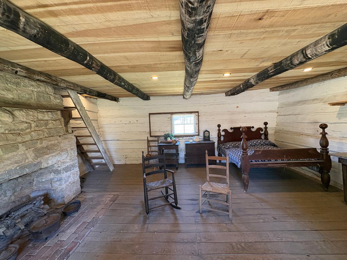 The cabin's interior is appointed with historical furniture and accoutrements. (Deena Bouknight)