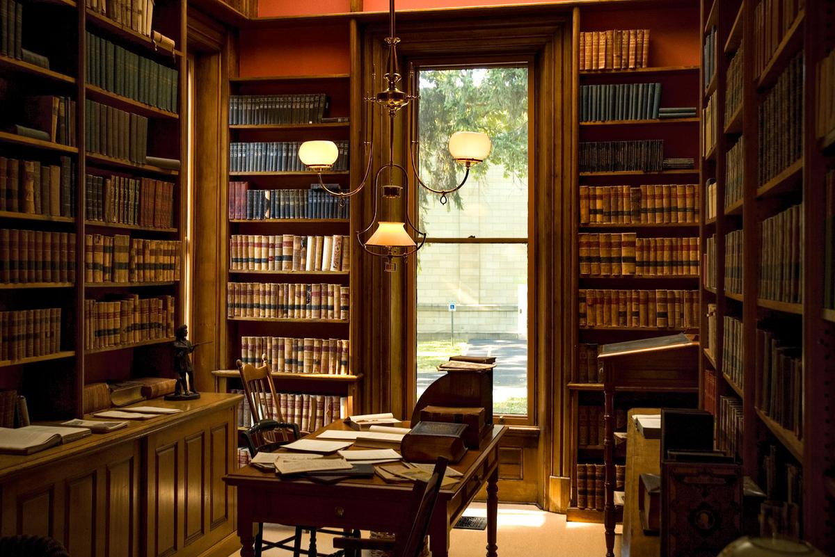 Built-in butternut wood shelving and cases house thousands of books collected by Hayes in his favorite room, the library. A low-hanging, bronze, three-light gasolier provides the room’s illumination, while the nearly floor-to-ceiling windows allow natural daylight to flow into the space. (Hayes Presidential Library & Museums)