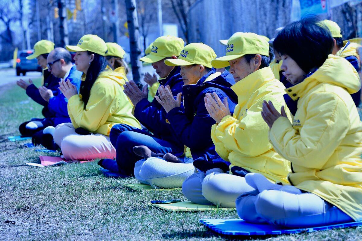 Falun Gong practitioners gather in front of the Chinese Embassy in Ottawa on April 22, 2026, to mark the 27th anniversary of their fellow adherents’ April 25, 1999, peaceful appeal in Beijing calling for freedom of belief. (Jonathan Ren/The Epoch Times)