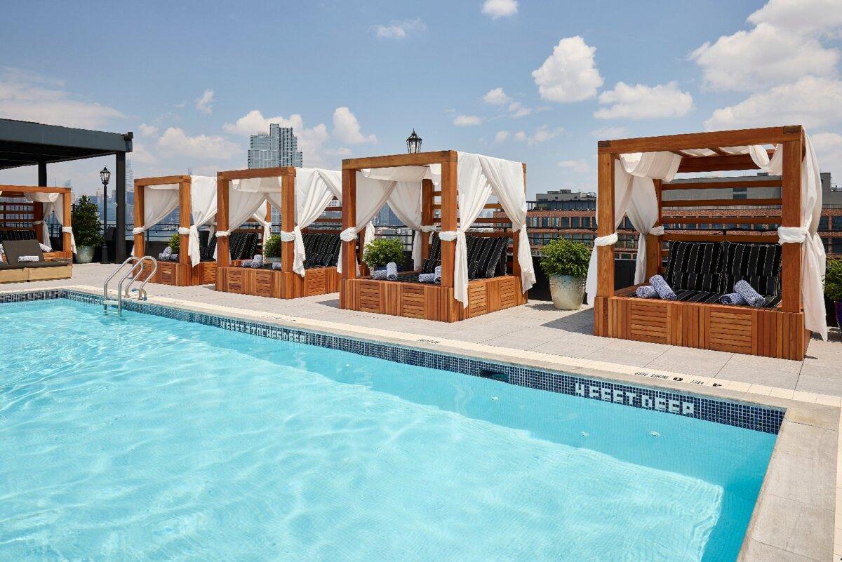 Cabanas at the Arlo Williamsburg in Brooklyn, New York, make an afternoon at the rooftop pool even more enticing. (Arlo Williamsburg)