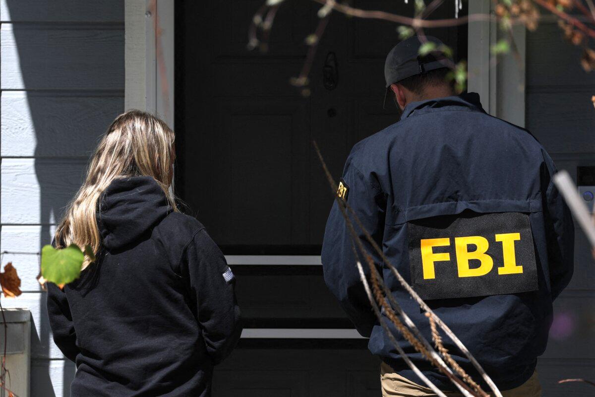 Members of the FBI knock on the doors of neighbors of a home associated with the suspected White House Correspondents’ Dinner shooter in Torrance, Calif., on April 26, 2026. (Patrick T. Fallon/AFP)