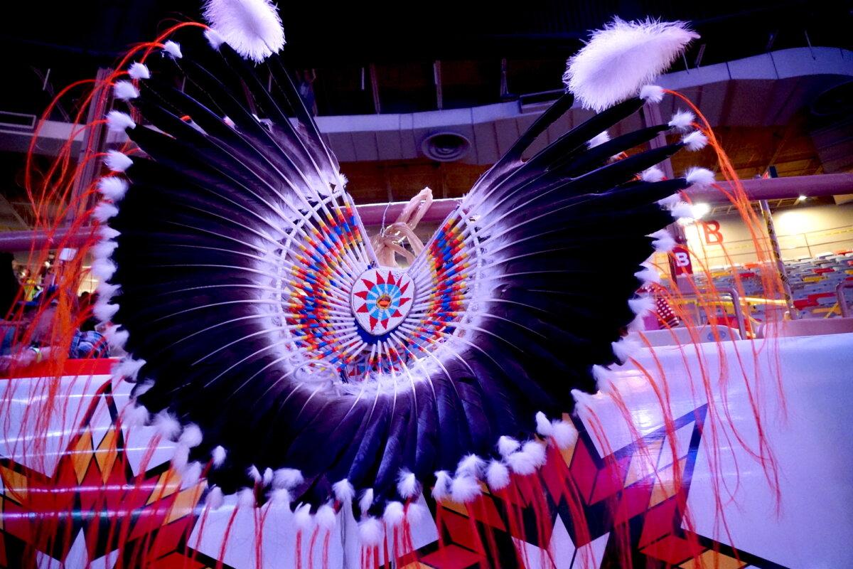 A Native American ceremonial bonnet hangs ready during the 43rd annual final Gathering of Nations powwow in Albuquerque, N.M., on April 24, 2026. (Allan Stein/The Epoch Times)