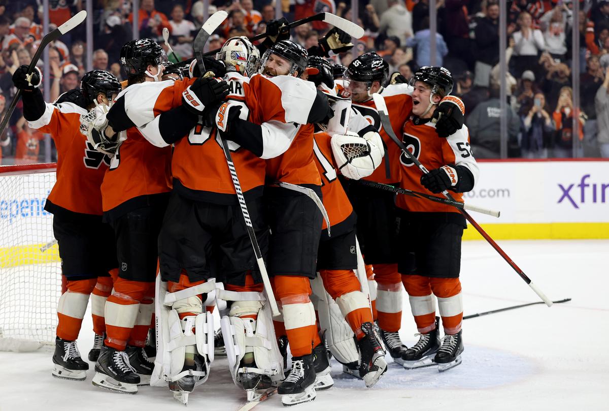 The Philadelphia Flyers celebrate a 3–2 win over the Carolina Hurricanes after a shootout to clinch a playoff spot at Xfinity Mobile Arena in Philadelphia, Pa., on April 13, 2026. (Emilee Chinn/Getty Images)