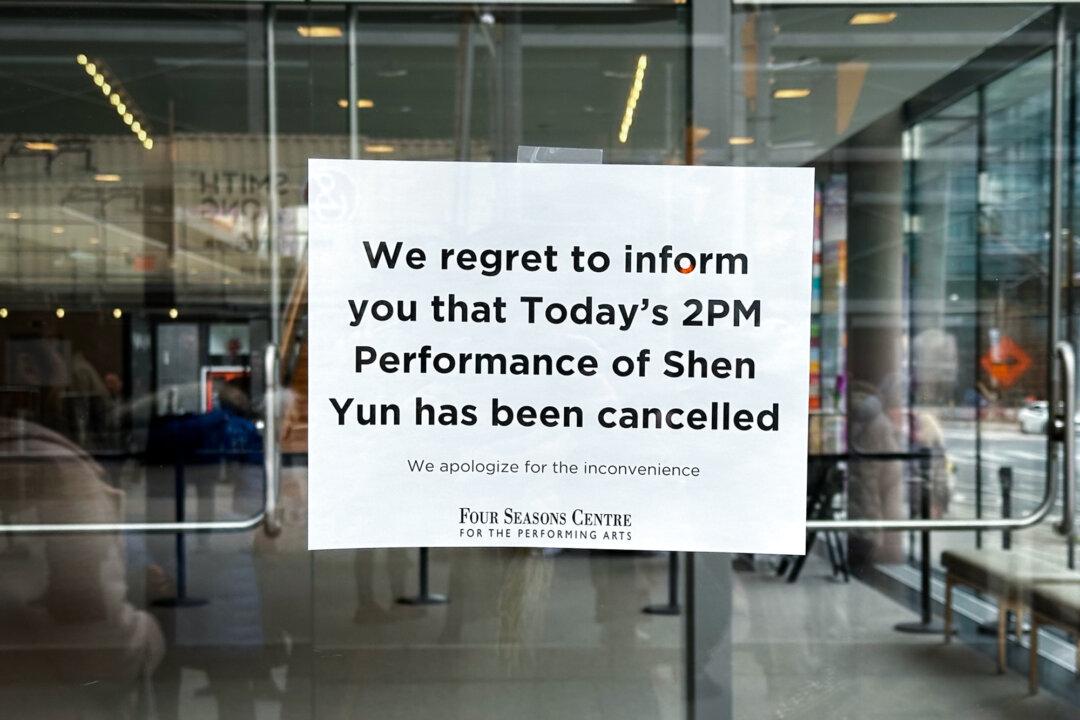 A sign informs patrons that Shen Yun’s Sunday performance has been canceled at the Four Seasons Centre for the Performing Arts in Toronto on March 29, 2026. Bomb threats appear to be the latest pivot in a long-running operation from China to suppress Shen Yun since its inception in 2006. In the past, that had largely involved diplomatic pressure, economic coercion, and visa blackmail. (The Epoch Times)