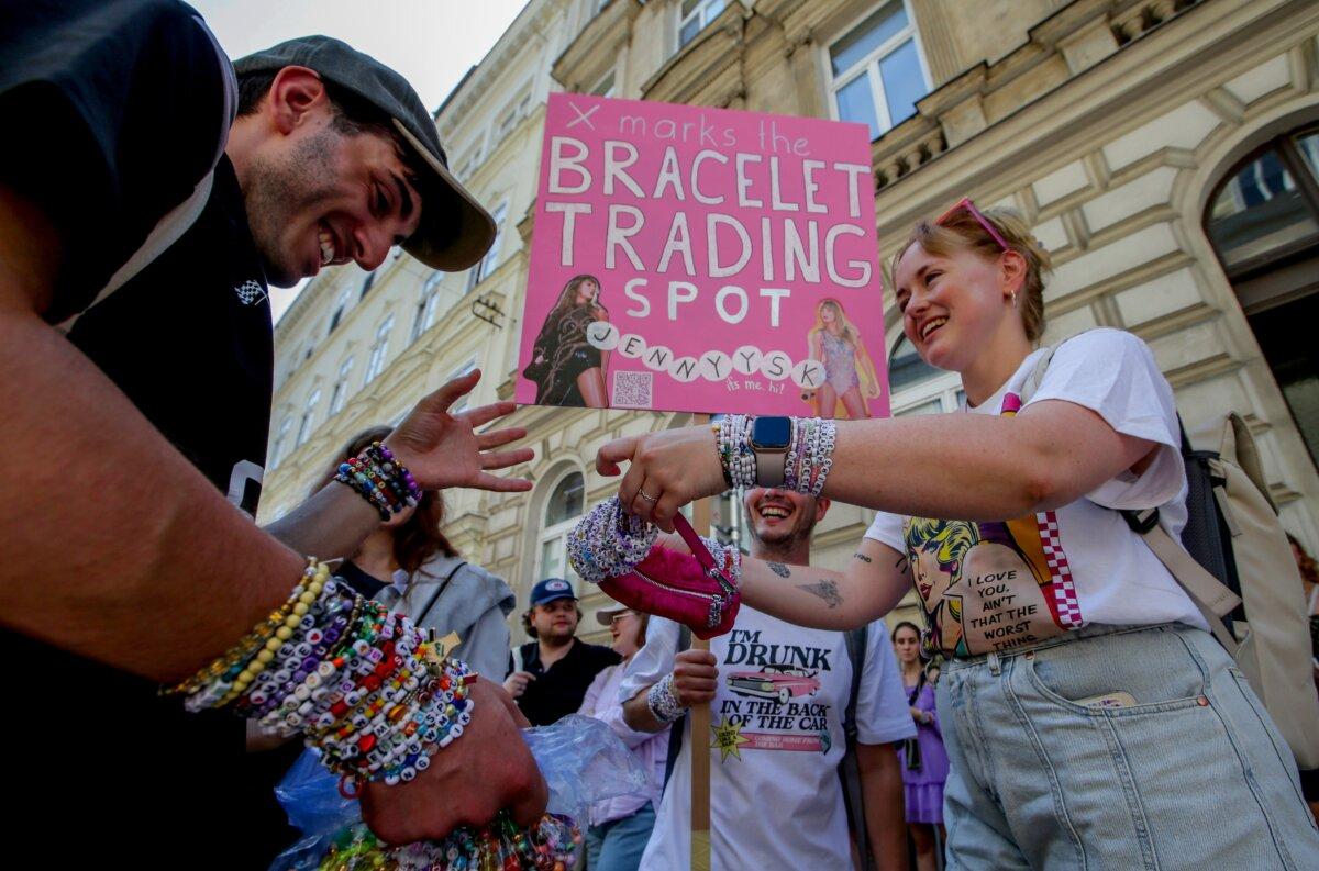 Taylor Swift fans trade bracelets in the city center of Vienna, Aug. 8, 2024. (Heinz-Peter Bader/AP Photo)