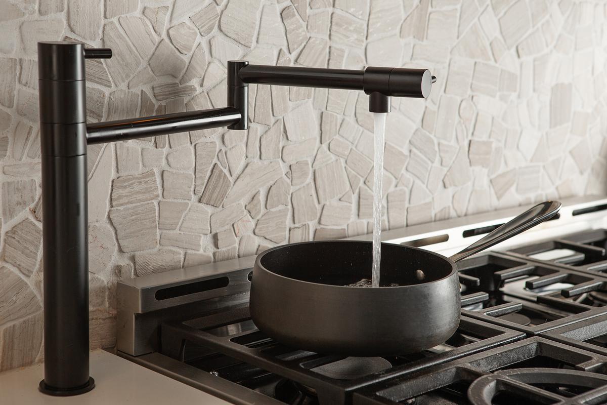 Pot fillers reduce the need to carry heavy pots of water from the sink to the stove. (ChristopherBernard/Getty Images)