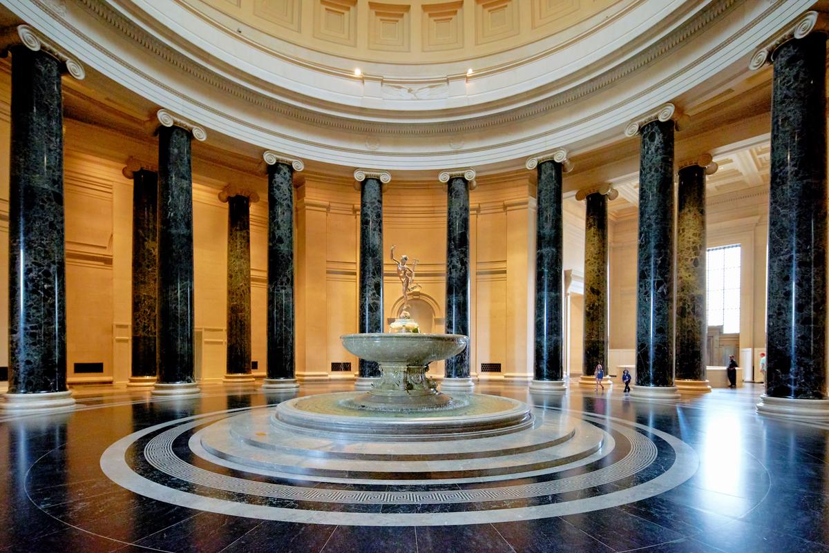 The central rotunda at the National Gallery of Art in Washington serves as the primary circulation axis of the museum. Modeled after the Roman Pantheon, the rotunda features a fountain with a bronze sculpture of Mercury (the Roman messenger god), encircled by 16 columns. (marcobriviophotographer/Shutterstock)