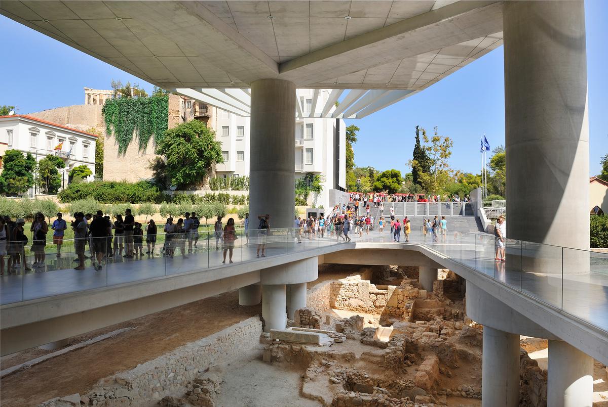 The Acropolis Museum was built over archaeological remains, allowing visitors to view them through glass floors and walls. (Atlantide Phototravel/Getty Images)