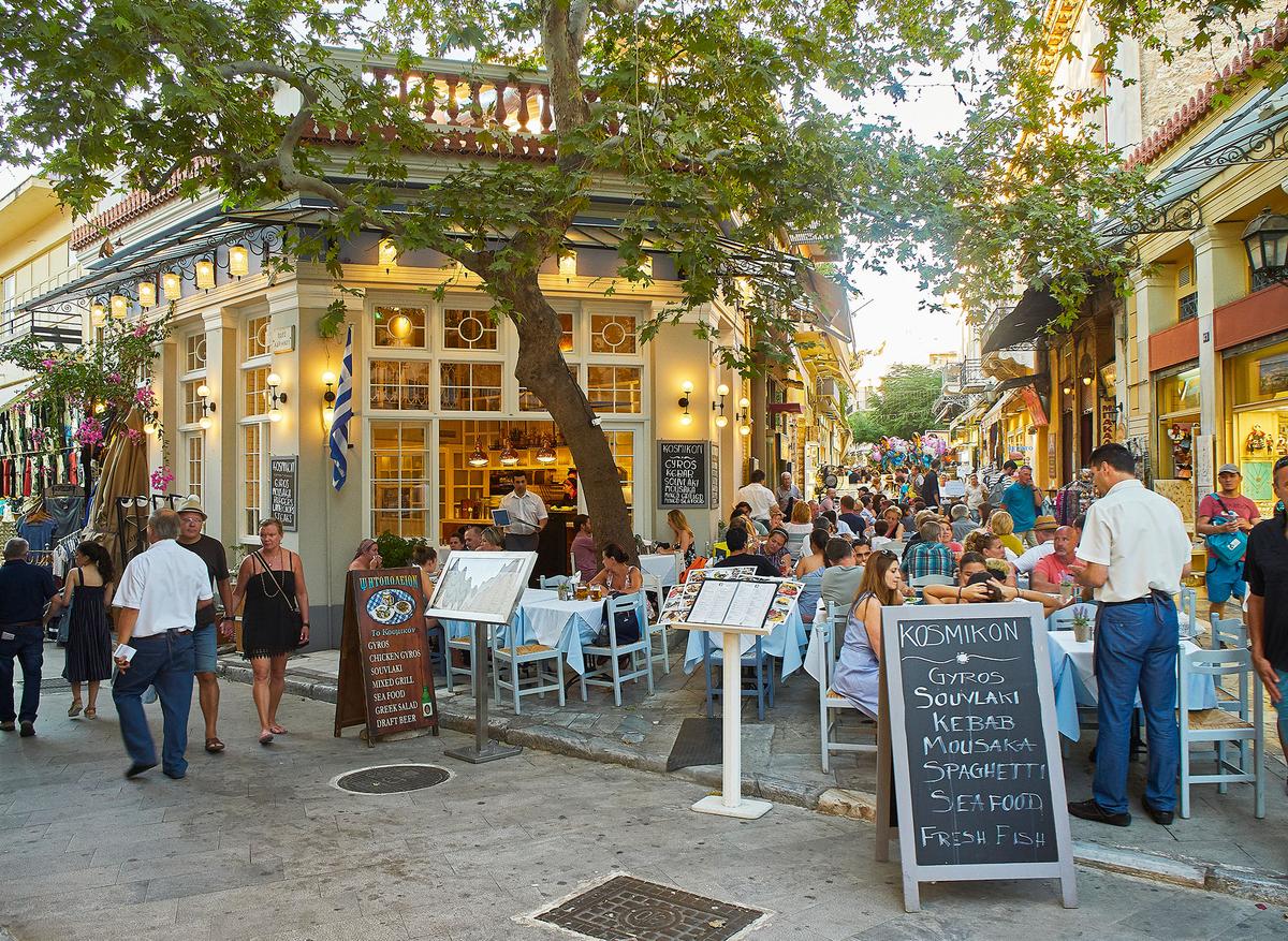 Many restaurants in the Plaka district offer outdoor seating with views of historic landmarks, including the Parthenon. (photooiasson/Getty Images)