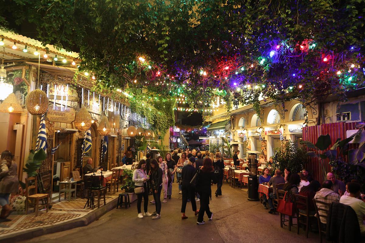 The Psyri neighborhood is known for its nightlife, featuring a mix of traditional tavernas, modern bars, and live music venues. (GoodLifeStudio/Getty Images)