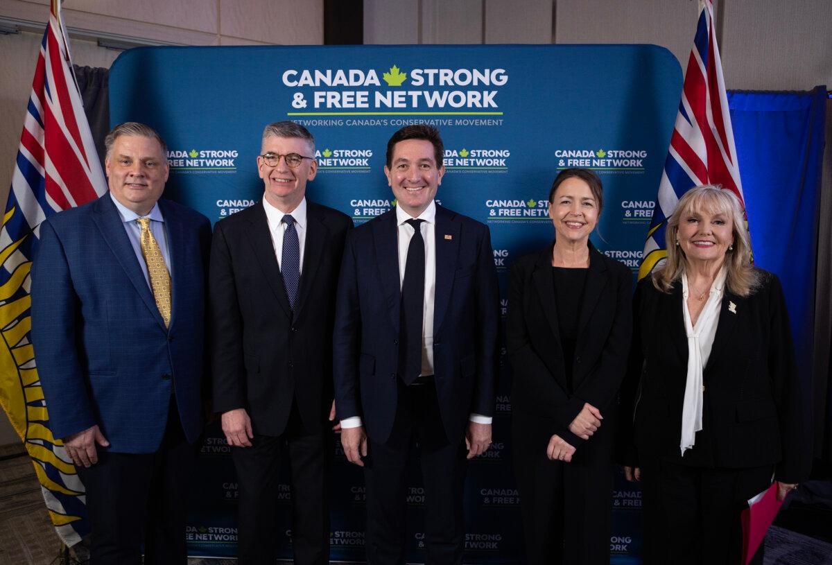 B.C. Conservative leadership candidates (L–R) Peter Milobar, Iain Black, Yuri Fulmer, Caroline Elliott, and Kerry-Lynne Findlay pose for a photograph following a debate at the Canada Strong and Free Network conference in Vancouver on April 24, 2026. (The Canadian Press/Chad Hipolito)