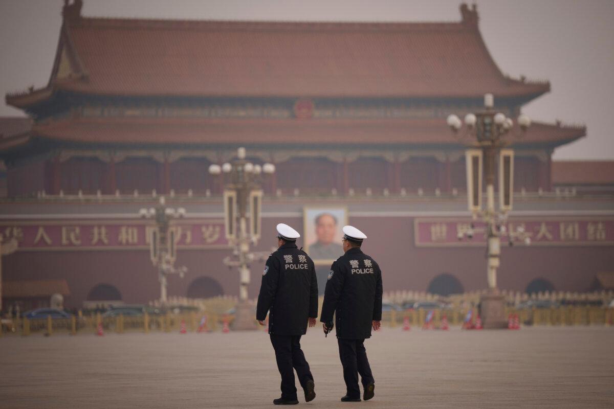 Police patrol Tiananmen Square before the closing session of the Chinese People's Political Consultative Conference in Beijing on March 10, 2025. (AP Photo/Vincent Thian)
