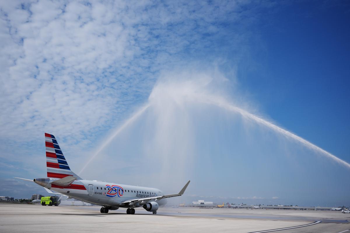American Airlines Flight AA3599, the first direct commercial flight between the United States and Venezuela in seven years, gets a water cannon salute as it taxis away from the gate at Miami International Airport on April 30, 2026. (AP Photo/Rebecca Blackwell)