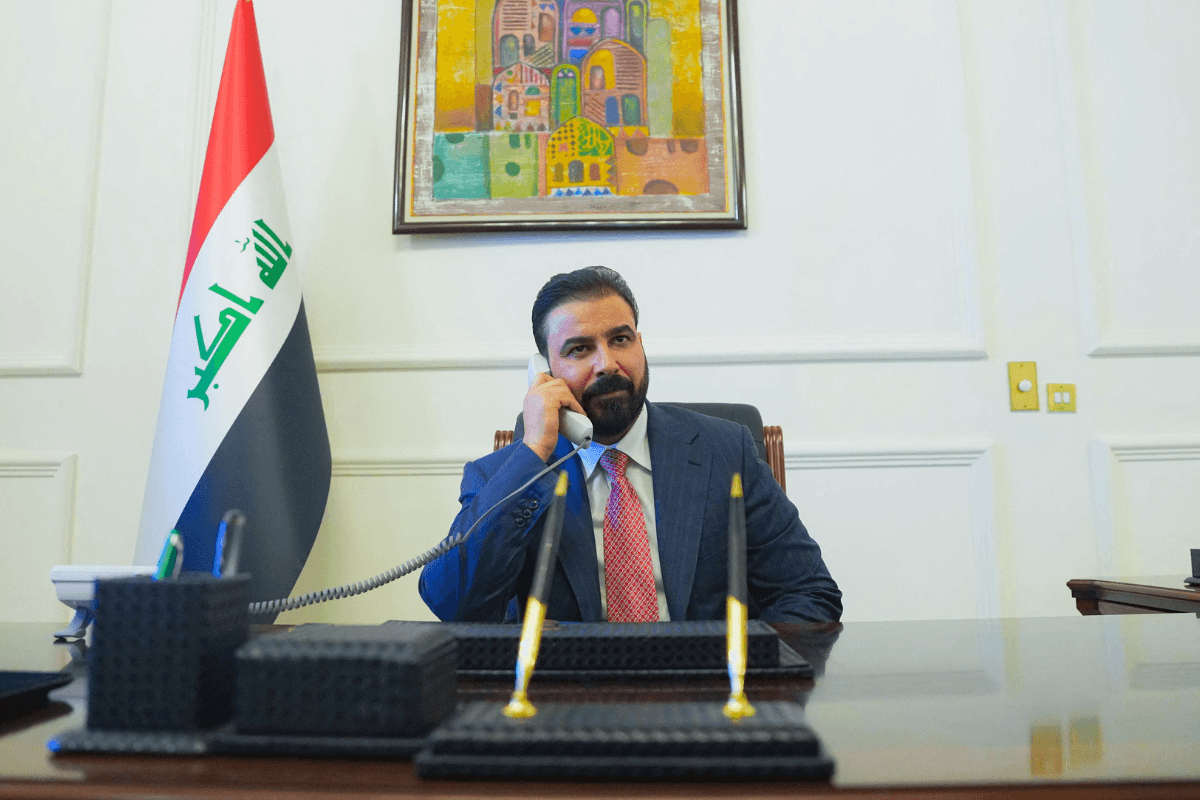 New Iraqi Prime Minister-designate Ali al-Zaidi uses a phone at his office in Baghdad, Iraq, on April 28, 2026. (Iraqi Prime Minister’s Media Office/Handout via Reuters)