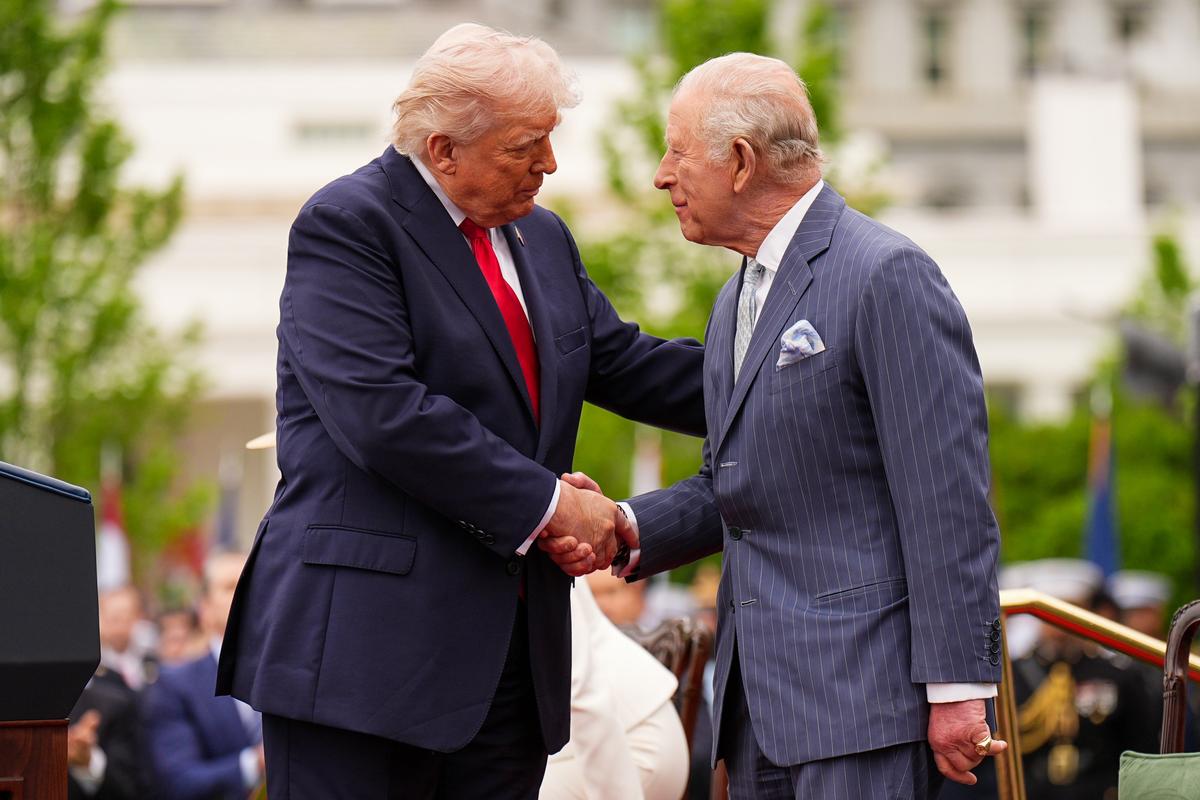 President Donald Trump (L) shakes the hand of King Charles III after speaking during the ceremonial welcome on the South Lawn of the White House in Washington on April 28, 2026. (Aaron Chown/Pool/Getty Images)