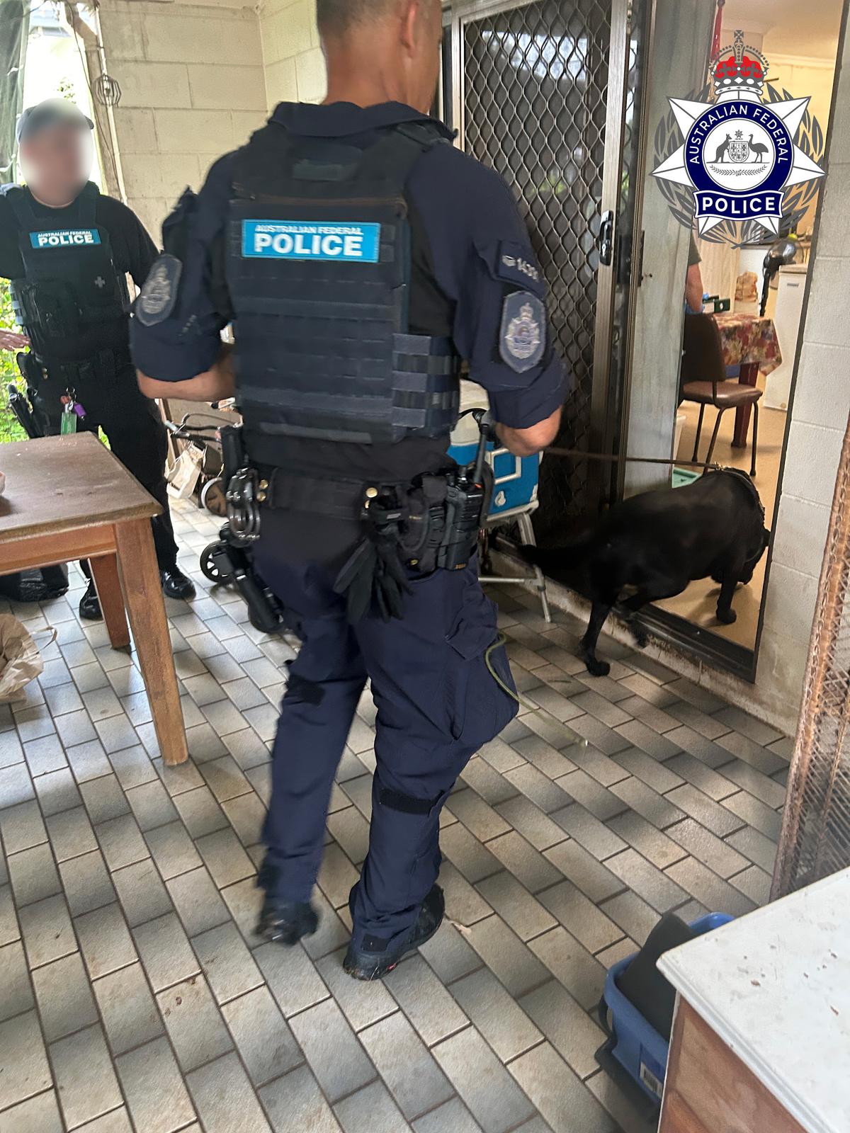 Police raid one of the properties in Cairns linked to a criminal syndicate, which is alleged to have defrauded the NDIS of in excess of $5 million. (Courtesy of the Australian Federal Police)