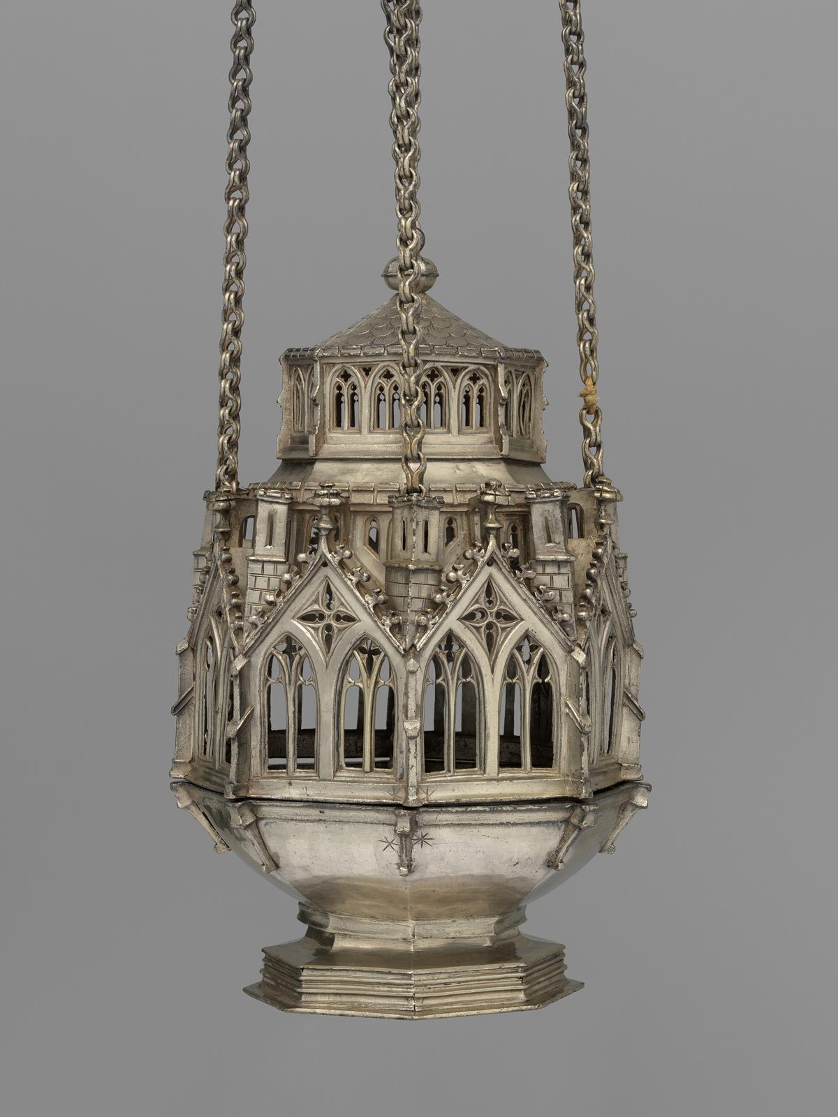 Censer, before 1477, by unidentified Swiss artist. Raised and cast silver; 31 7/8 inches by 5 3/4 inches. (Courtesy of the Metropolitan Museum of Art, New York City)
