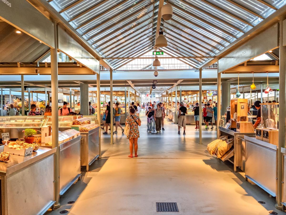 Porto's historic public market, Mercado de Bolhão, is housed in a restored Beaux-Arts-style building and features about 80 stalls selling food, services, and souvenirs. (Travel-Fr/Shutterstock)