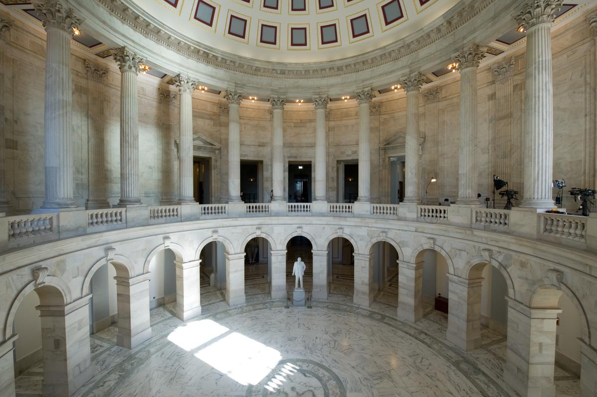 The southwest entrance of the Russell Senate Office Building opens into a three-story rotunda topped with a coffered dome. The room’s diameter is a little over 57 feet. Inlaid into the marble floor, directly in line with the dome’s oculus, is a simple design of an inner and outer circle. (Public Domain)