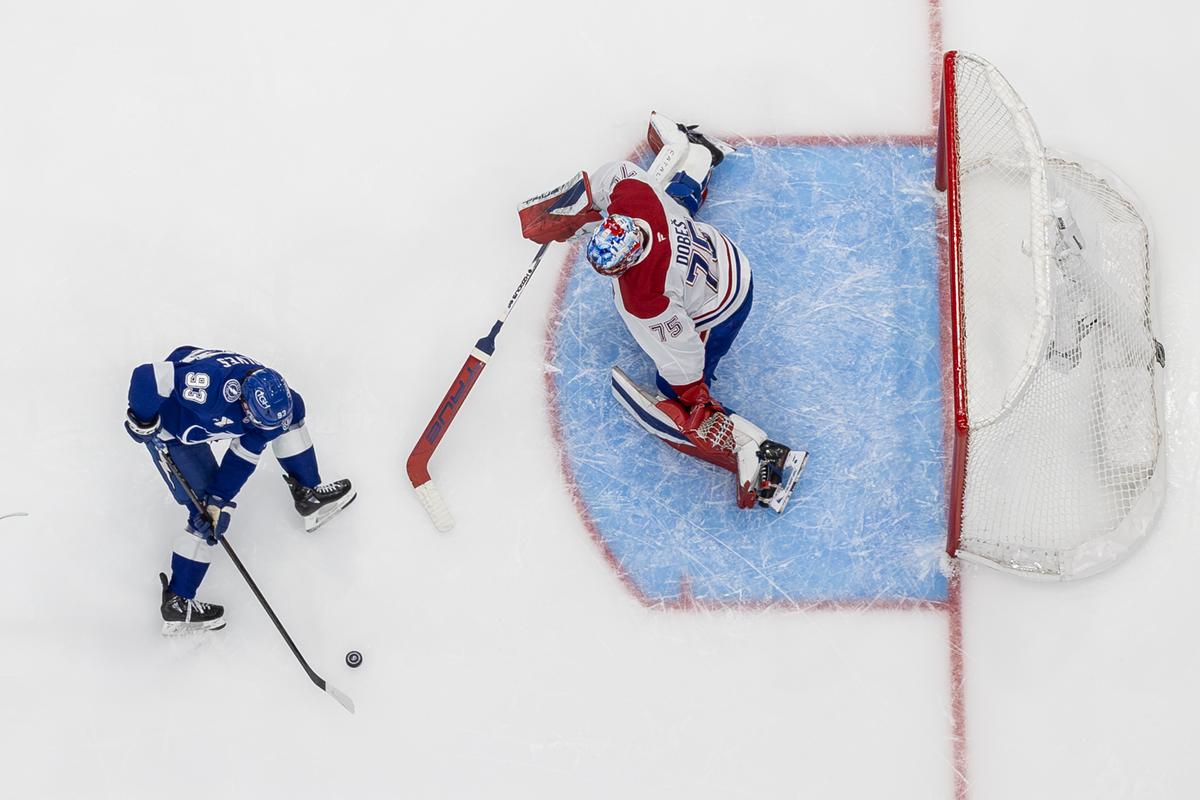 Jakub Dobes #75 of the Montréal Canadiens makes a save against Gage Goncalves #93 of the Tampa Bay Lightning in the first period of Game 7 of the First Round of the 2026 Stanley Cup Playoffs at the Benchmark International Arena in Tampa, Fla., on May 3, 2026. (Mike Carlson/Getty Images)