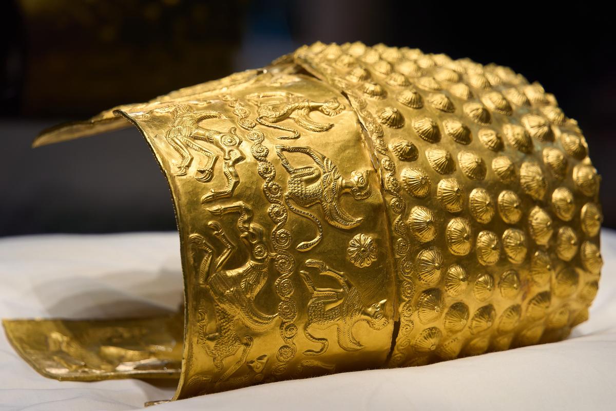 A detailed image of damage sustained during the museum theft, visible as a bending of a formerly restored tear to the golden helmet of Cotofenesti. (LCV/Shutterstock)