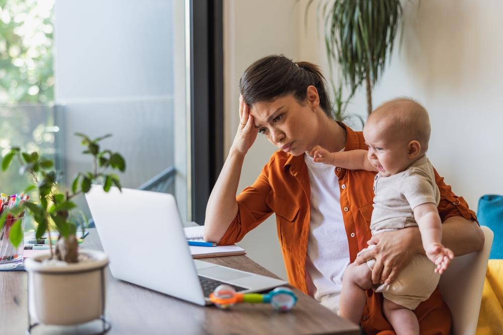 After becoming moms, many women find it hard to juggle work and home responsibilities. (MilanMarkovic78/Shutterstock)