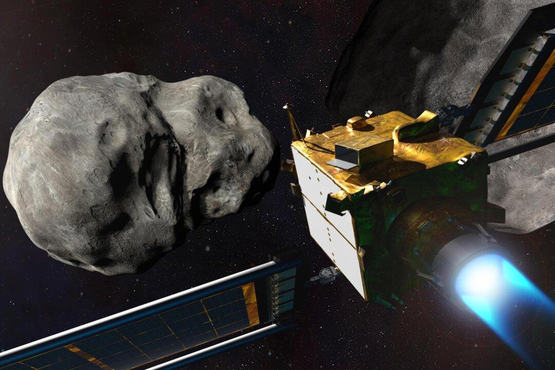 An illustration depicts NASA’s Double Asteroid Redirection Test (DART) spacecraft prior to impact at the Didymos binary asteroid system. The mission tested whether intentionally crashing a spacecraft into an asteroid is an effective way to change its course, should an Earth-threatening asteroid be discovered in the future. (Steve Gribben/Johns Hopkins APL/NASA)