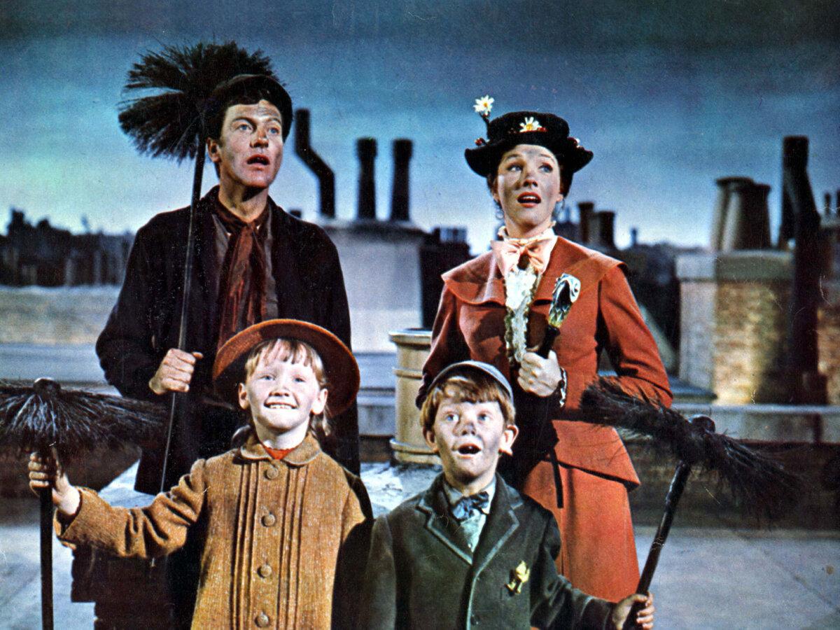 Bert (Dick Van Dyke), Jane (Karen Dotrice), Michael (Matthew Garber), and Mary Poppins (Julie Andrews), in “Mary Poppins.” (Walt Disney Pictures/MovieStillsDB)