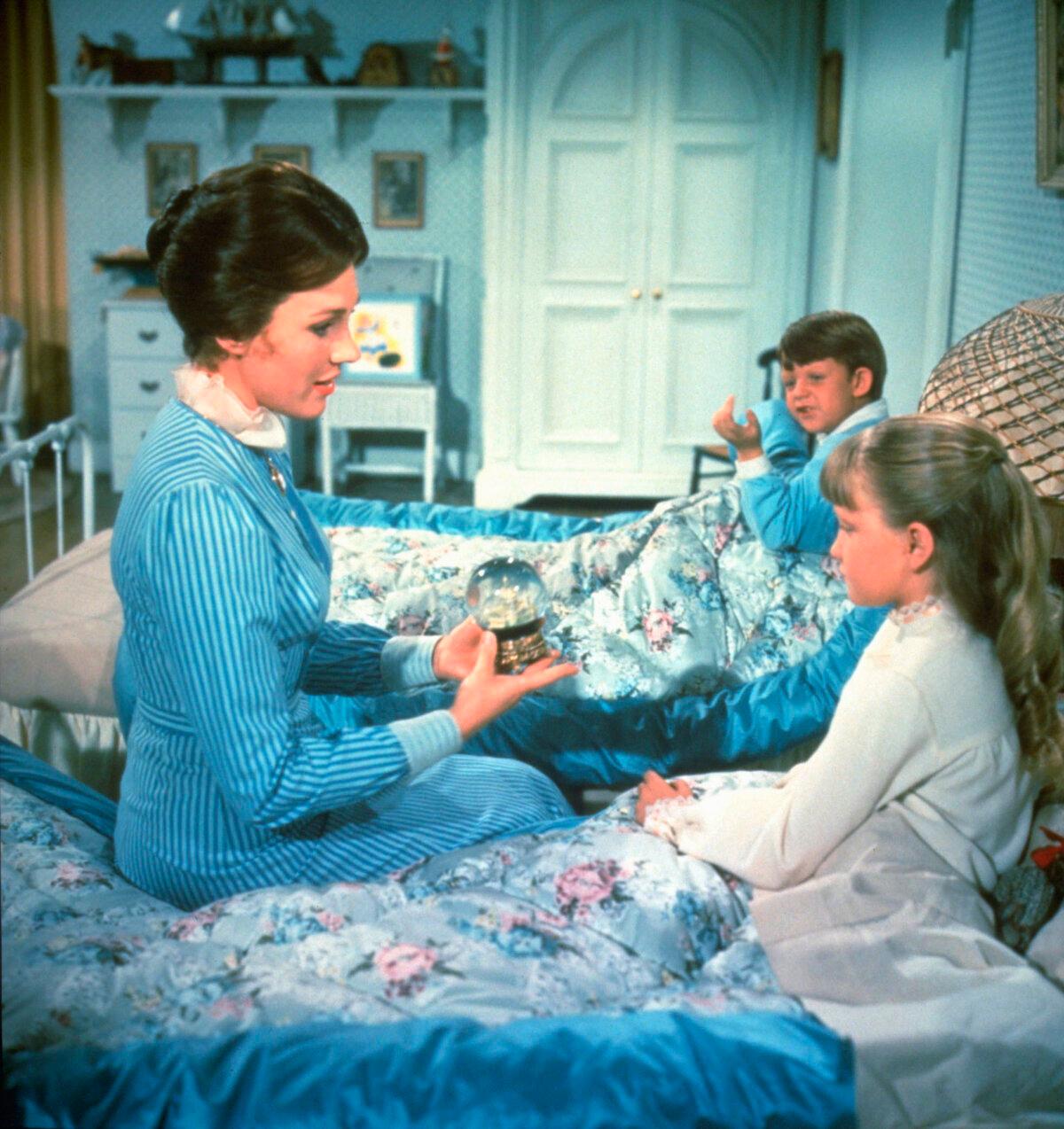 Mary Poppins (Julie Andrews), Michael (Matthew Garber), and Jane (Karen Dotrice), in “Mary Poppins.” (Walt Disney Pictures/MovieStillsDB)