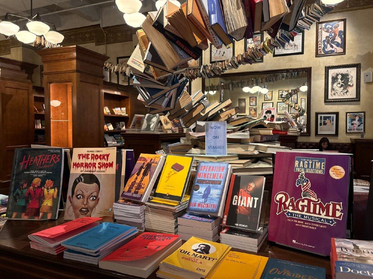 The Drama Book Shop in New York City's Theater District stocks musical songbooks and play and musical scripts along with behind-the-scenes-of-Broadway reads amid a fantastical installment of books spiraling across the ceiling and a visual explosion of pages into the back wall. (Alison Ramsey)
